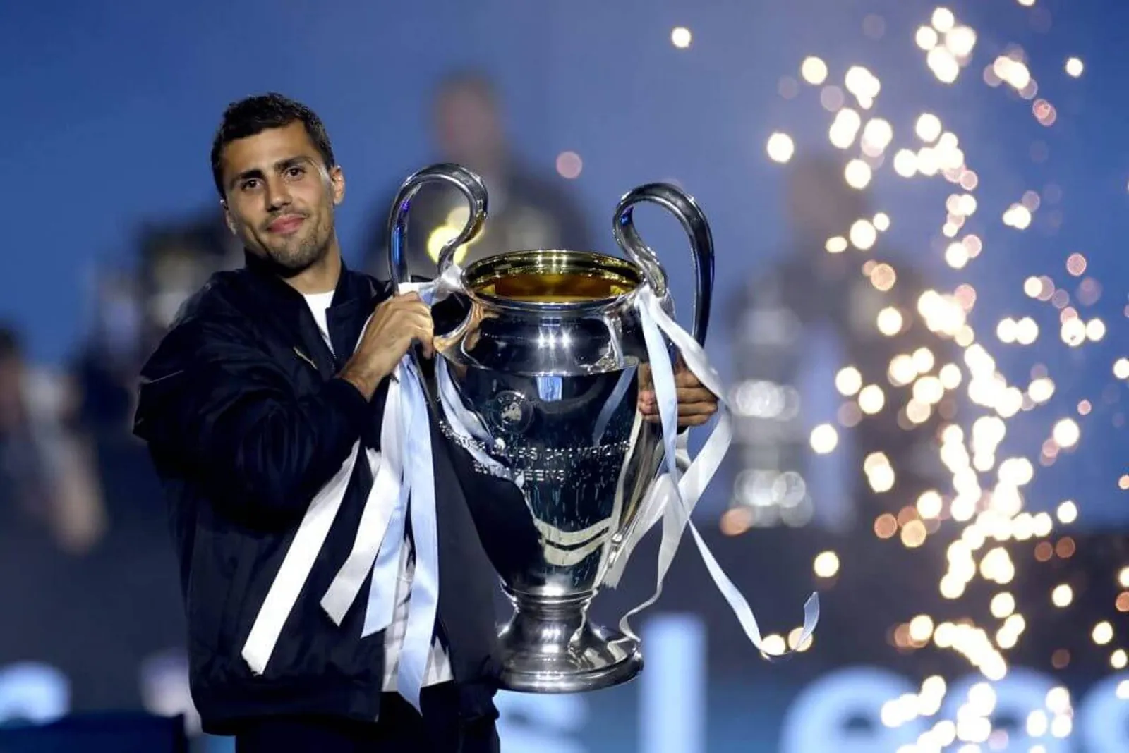 Rodri holds the Champions League trophy aloft after Manchester City's win in 2023