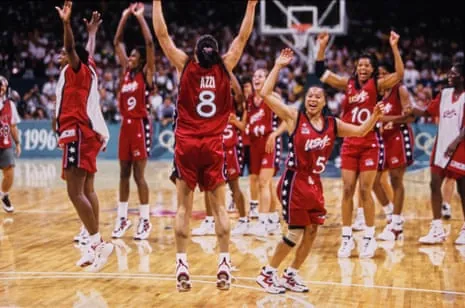 Jennifer Azzi (8), Dawn Staley (5) and the rest of the US women’s basketball team celebrate after winning the gold medal against Brazil.