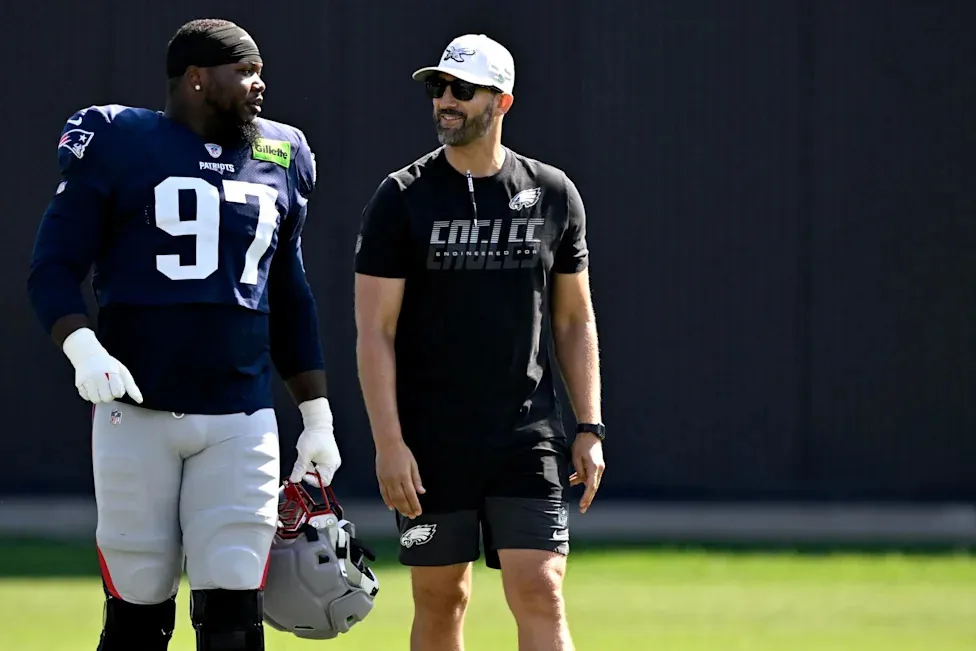 FOXBOROUGH, MASSACHUSETTS - AUGUST 19: Head coach Nick Sirianni of the Philadelphia Eagles reacts with Milton Williams #97 of the New England Patriots during a joint practice at Gillette Stadium on August 19, 2026 in Foxborough, Massachusetts. (Photo by Billie Weiss/Getty Images) | Getty Images