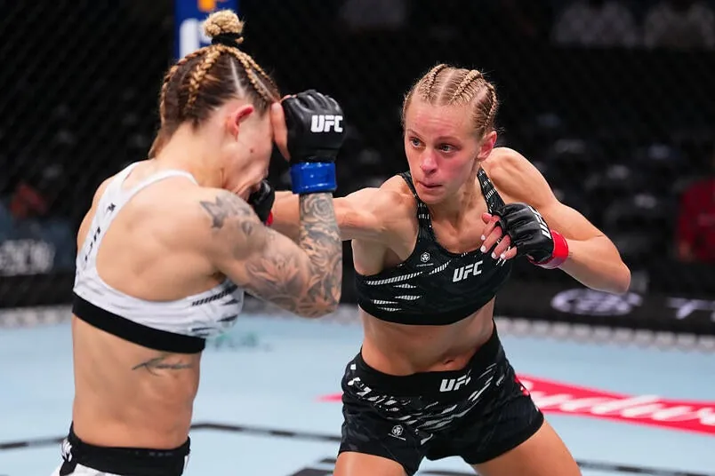Carli Judice punches Nicolle Caliari of Brazil in a flyweight bout during the UFC 318 event at Smoothie King Center on July 19, 2025 in New Orleans, Louisiana. (Photo by Cooper Neill/Zuffa LLC)